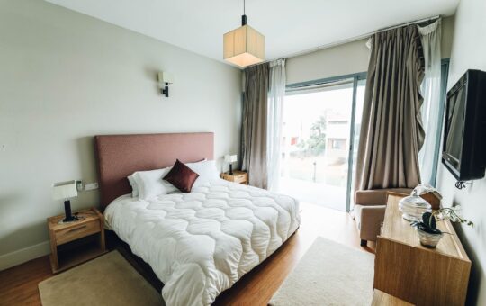 white bed near window